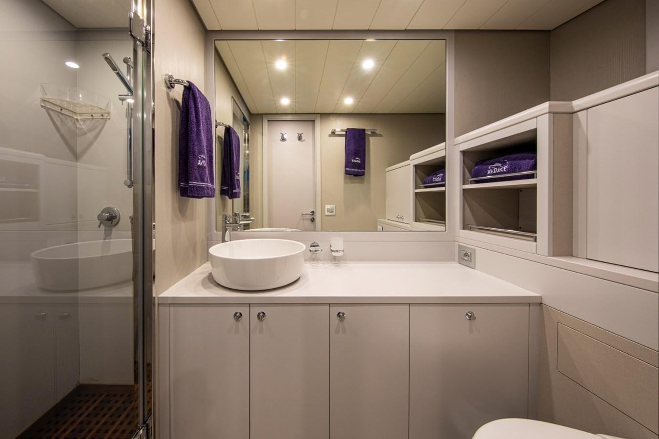 a bathroom with a sink and a mirror aboard AUDACE Yacht for Sale