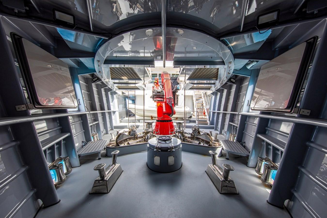 a large room with a large glass ceiling and a red and white robot aboard AUDACE Yacht for Sale