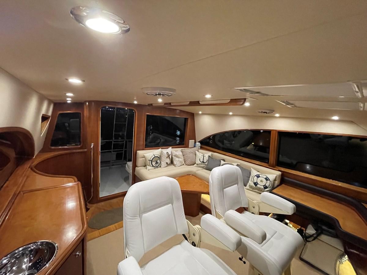 a room with a couch and a television aboard REEL BUSY Yacht for Sale