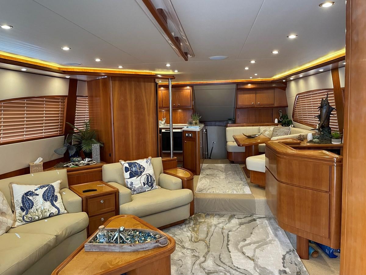 a living room with wood walls aboard REEL BUSY Yacht for Sale