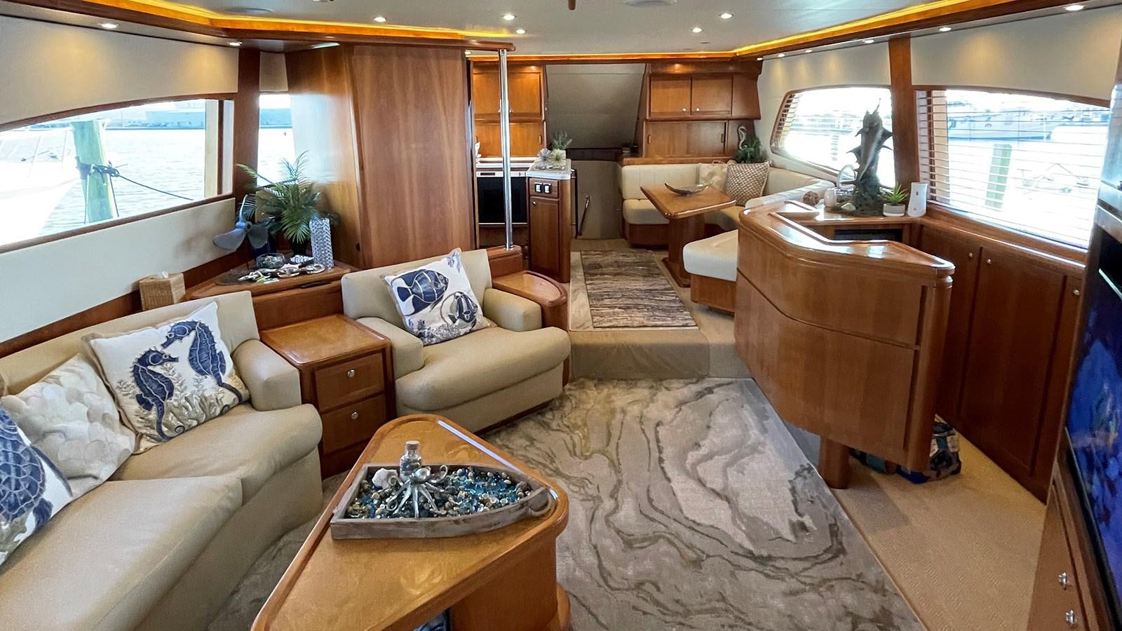 a living room with a large window aboard REEL BUSY Yacht for Sale