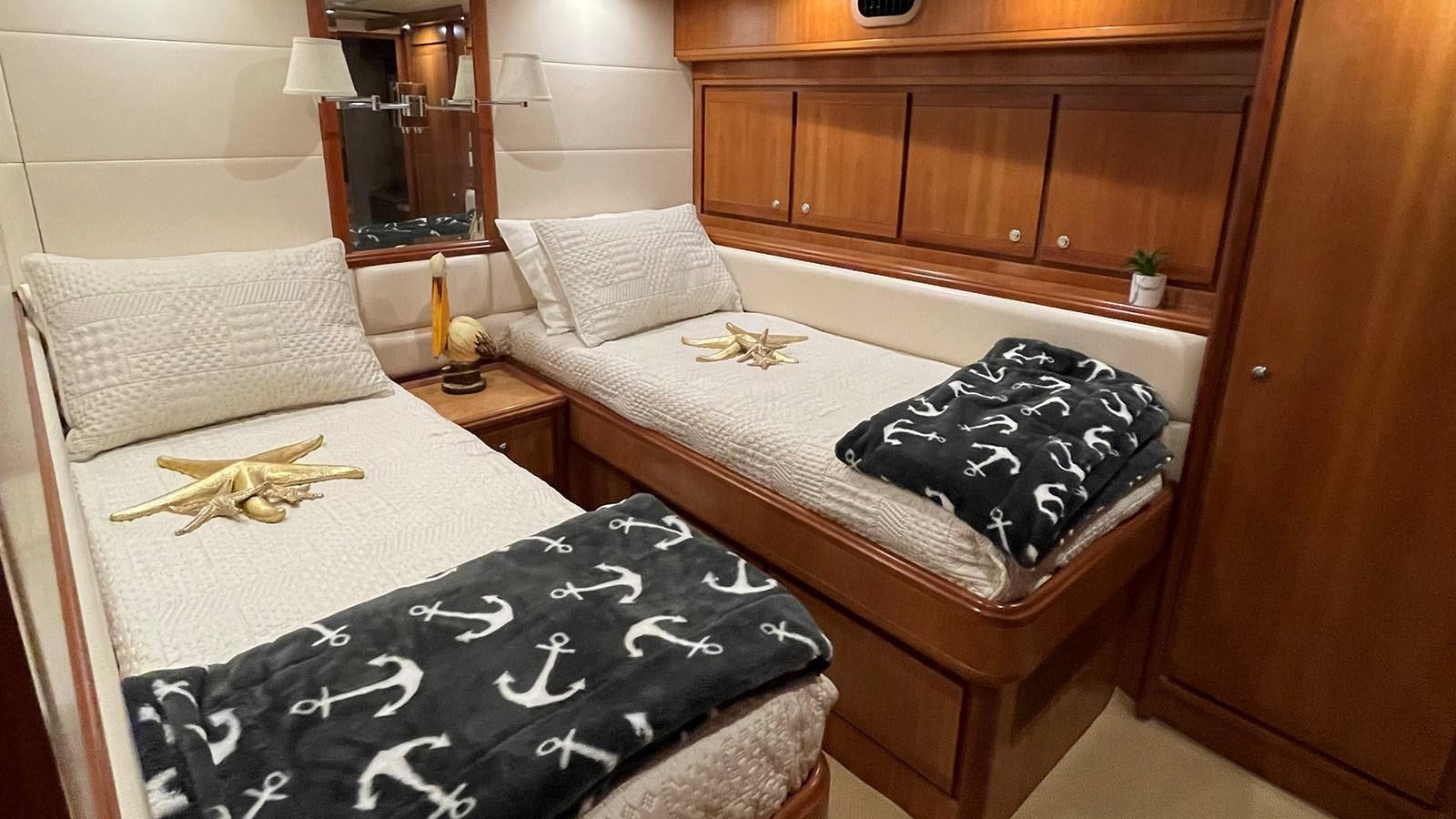 a couple of beds in a room aboard REEL BUSY Yacht for Sale