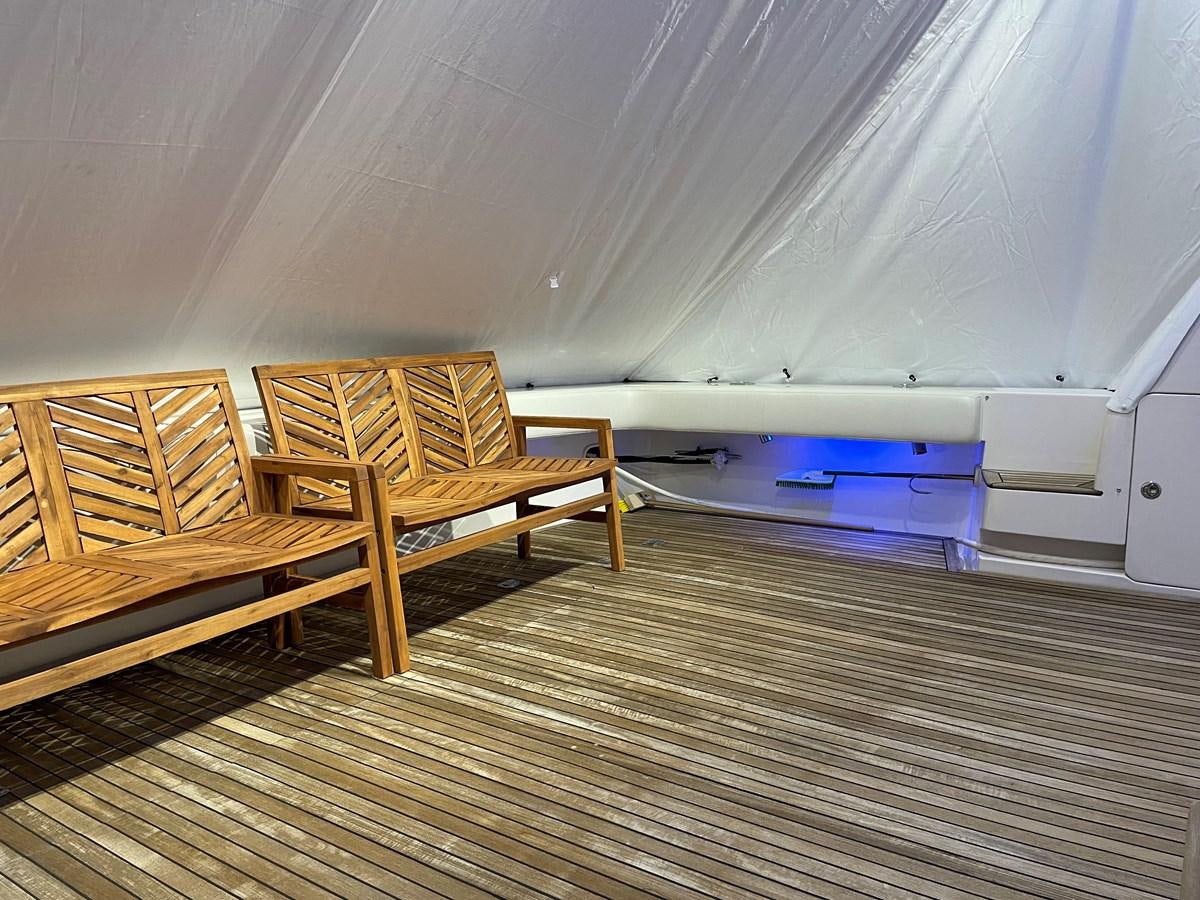 a room with a bench and a pool table aboard REEL BUSY Yacht for Sale