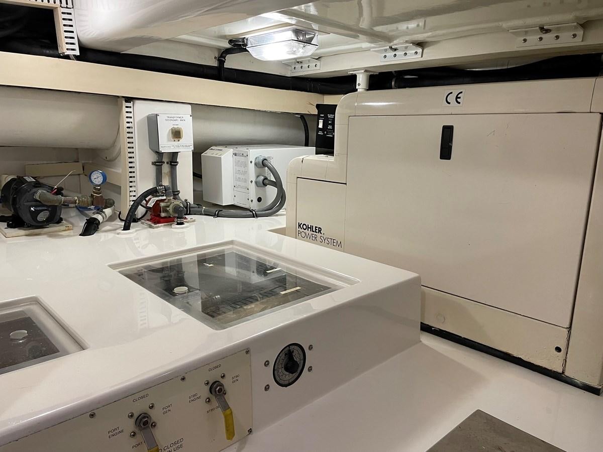 a white machine in a room aboard REEL BUSY Yacht for Sale