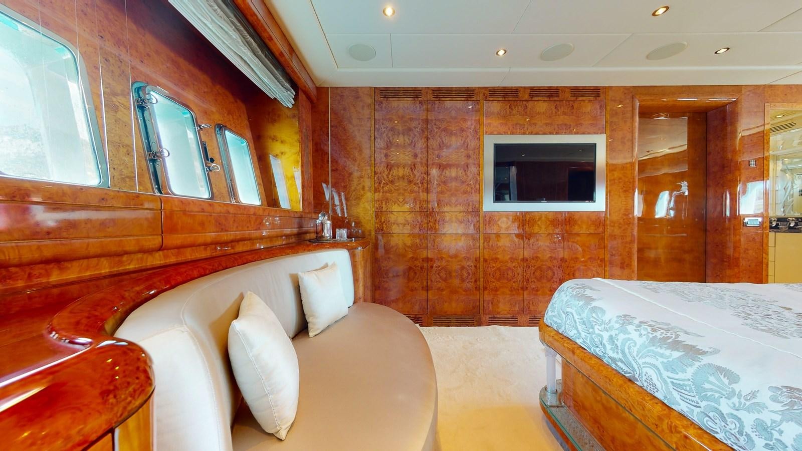 a room with a bed and a couch aboard SPLENDIDA Yacht for Sale