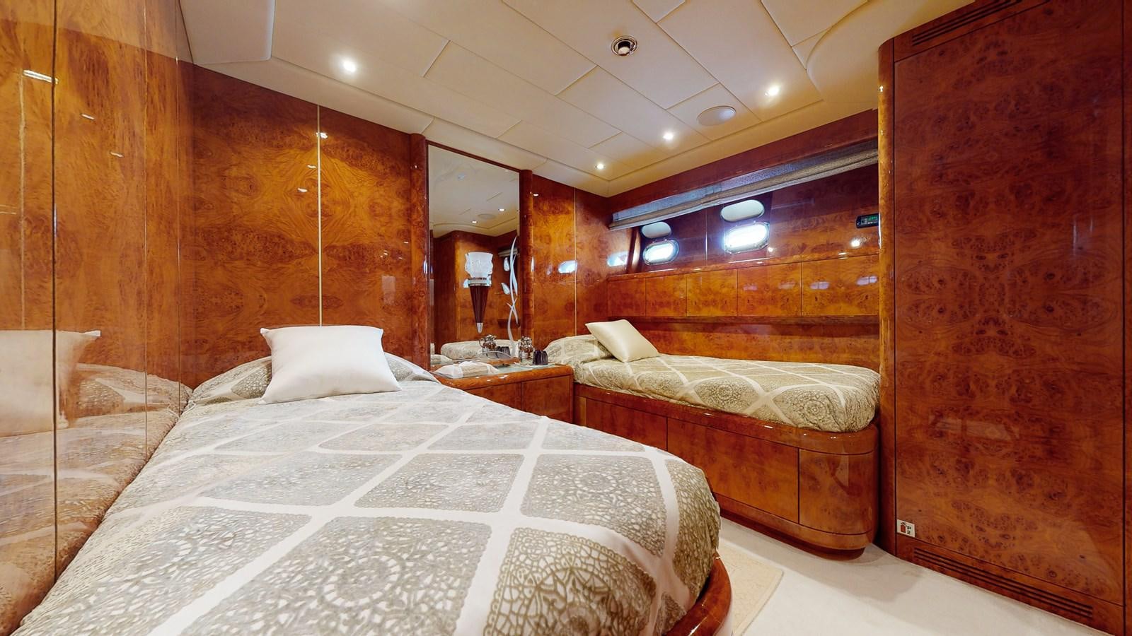 a room with a bed and a mirror aboard SPLENDIDA Yacht for Sale