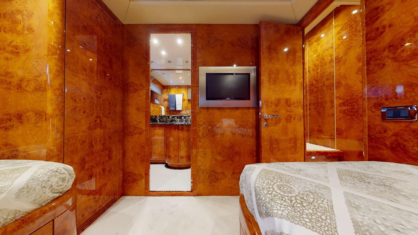 a room with a television and a bed aboard SPLENDIDA Yacht for Sale