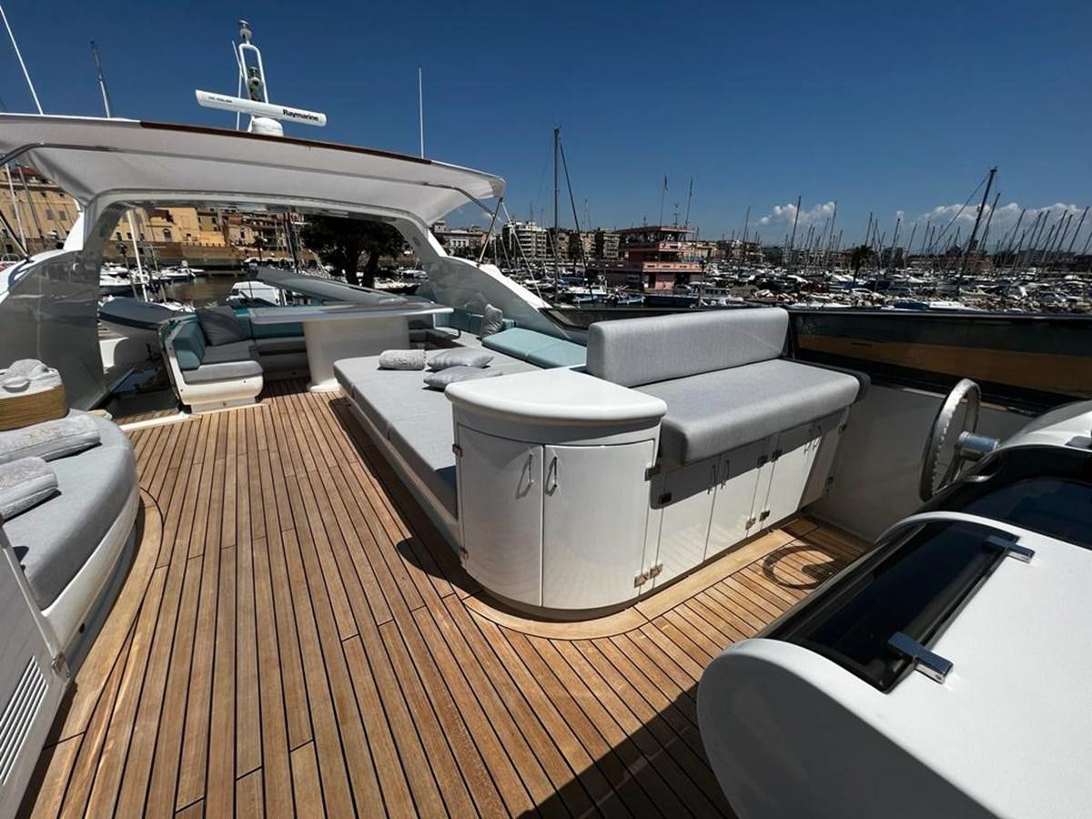 a deck with a deck and a boat on it aboard DEAONE Yacht for Sale