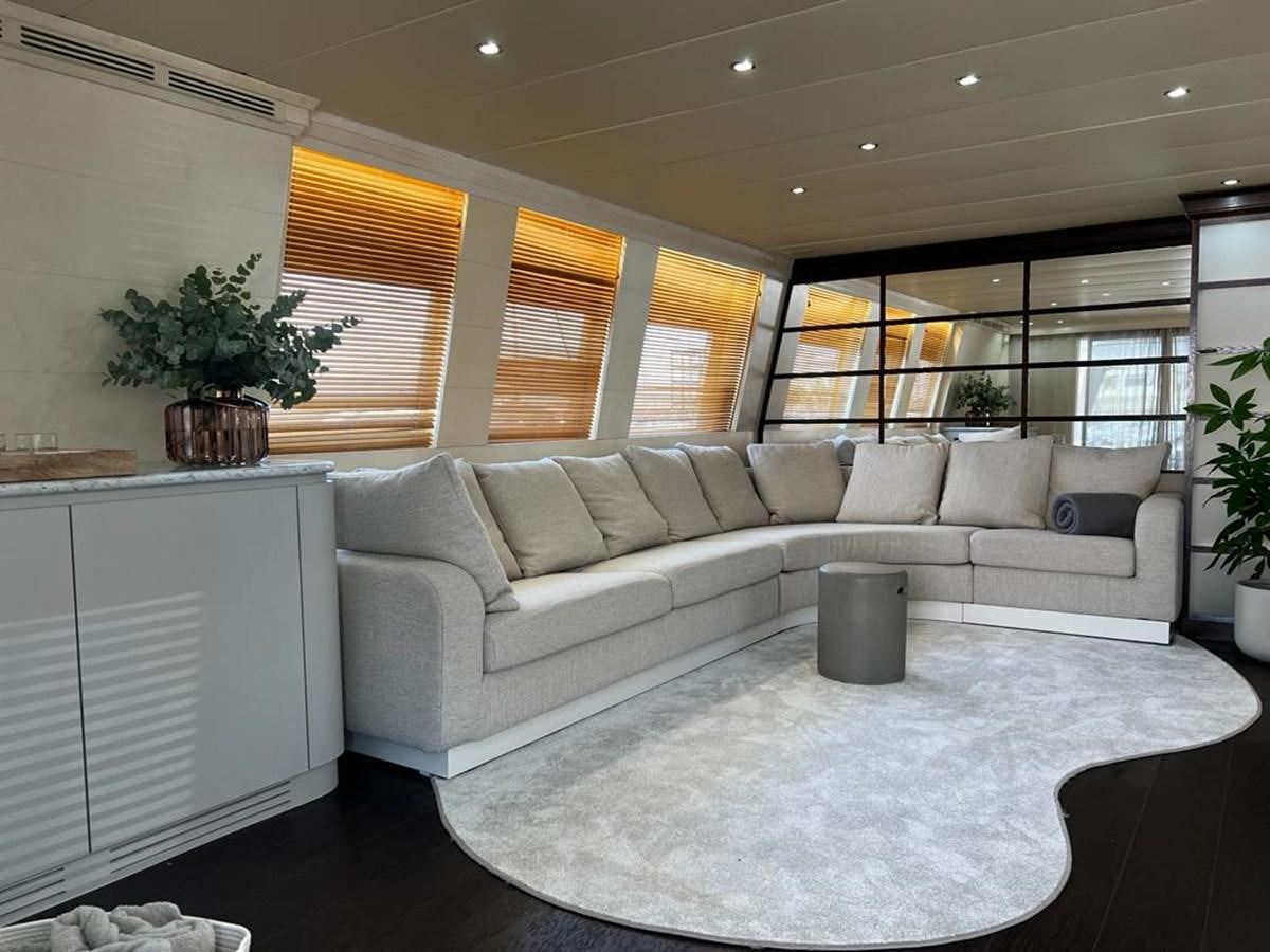 a living room with a couch and a plant aboard DEAONE Yacht for Sale