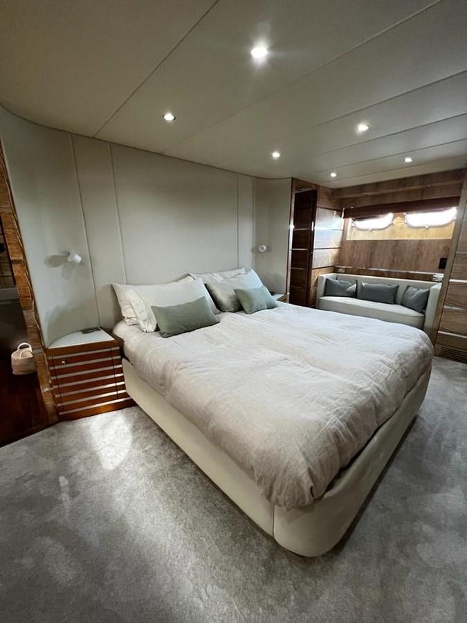a large bed in a hotel room aboard DEAONE Yacht for Sale