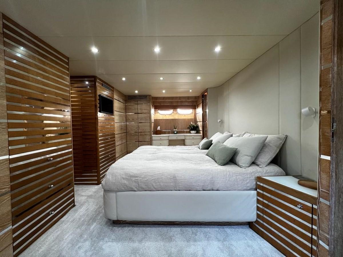 a large bedroom with a large bed aboard DEAONE Yacht for Sale