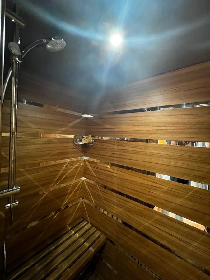 a boat on a wooden deck aboard DEAONE Yacht for Sale