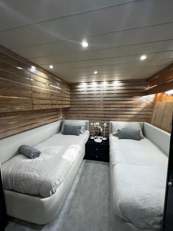 a room with two beds aboard DEAONE Yacht for Sale