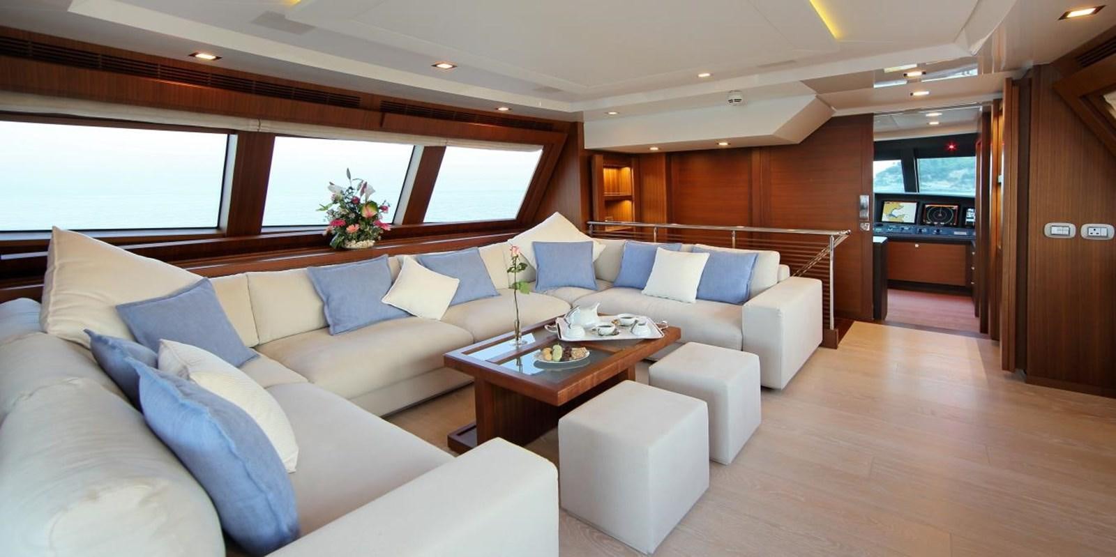 a large living room with a large window aboard VELA Yacht for Sale