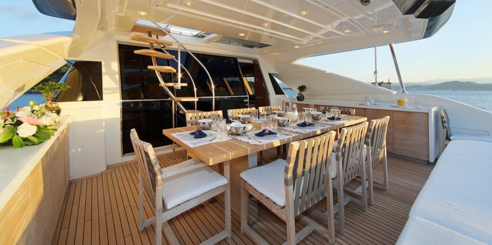 a table set for a meal aboard VELA Yacht for Sale