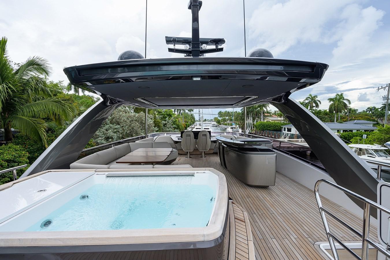 a large black and white boat on a deck aboard ESCAPE Yacht for Sale
