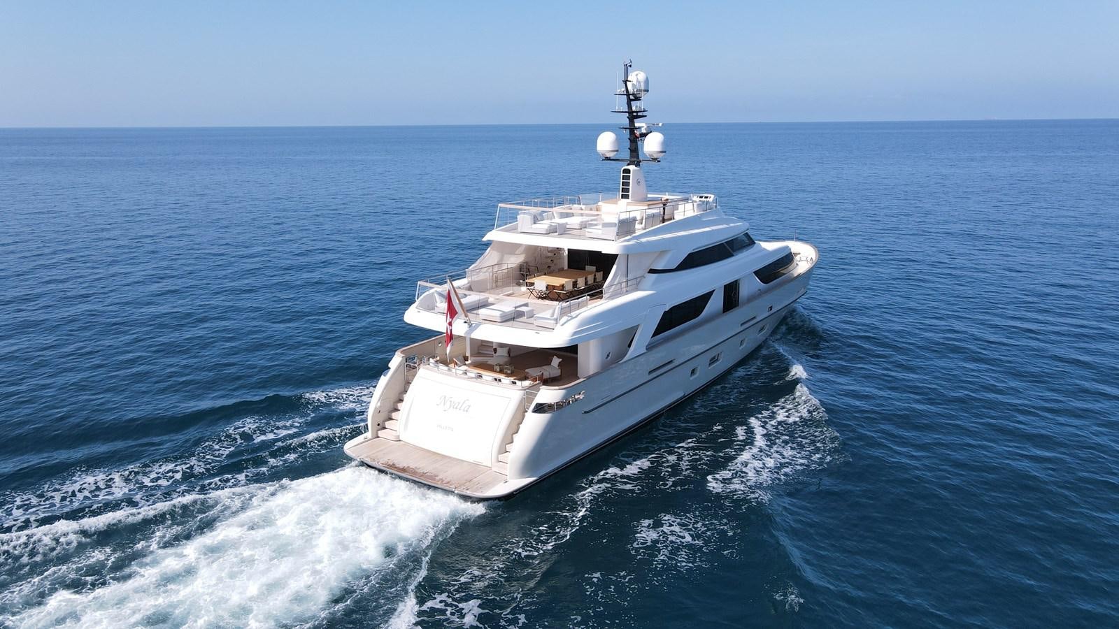 a white boat on the water aboard NAYA 7 Yacht for Sale
