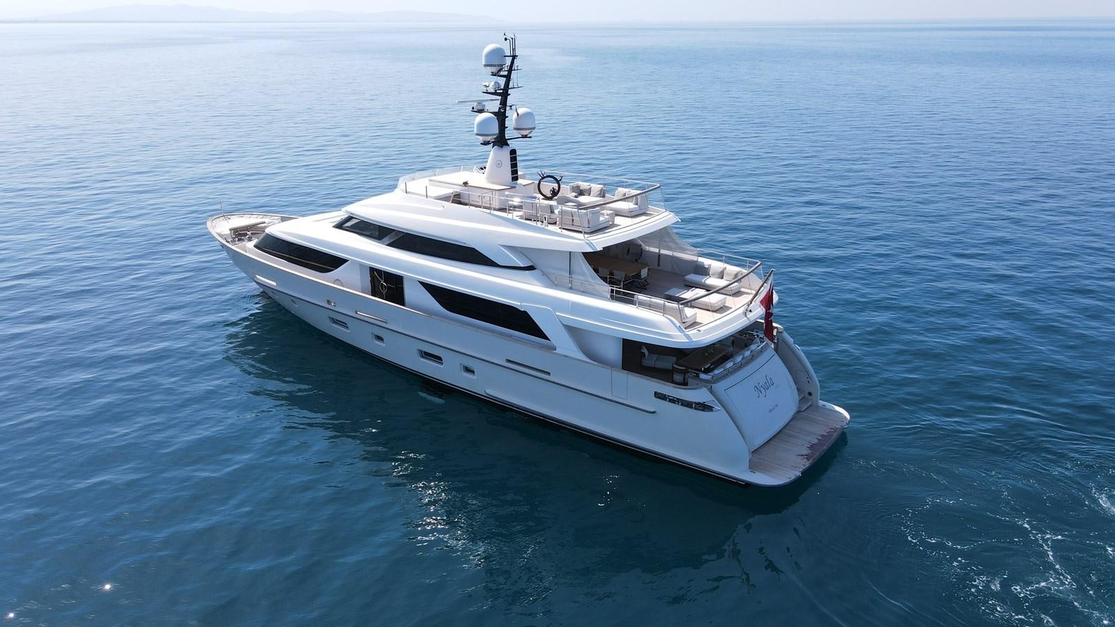 a white boat in the water aboard NAYA 7 Yacht for Sale