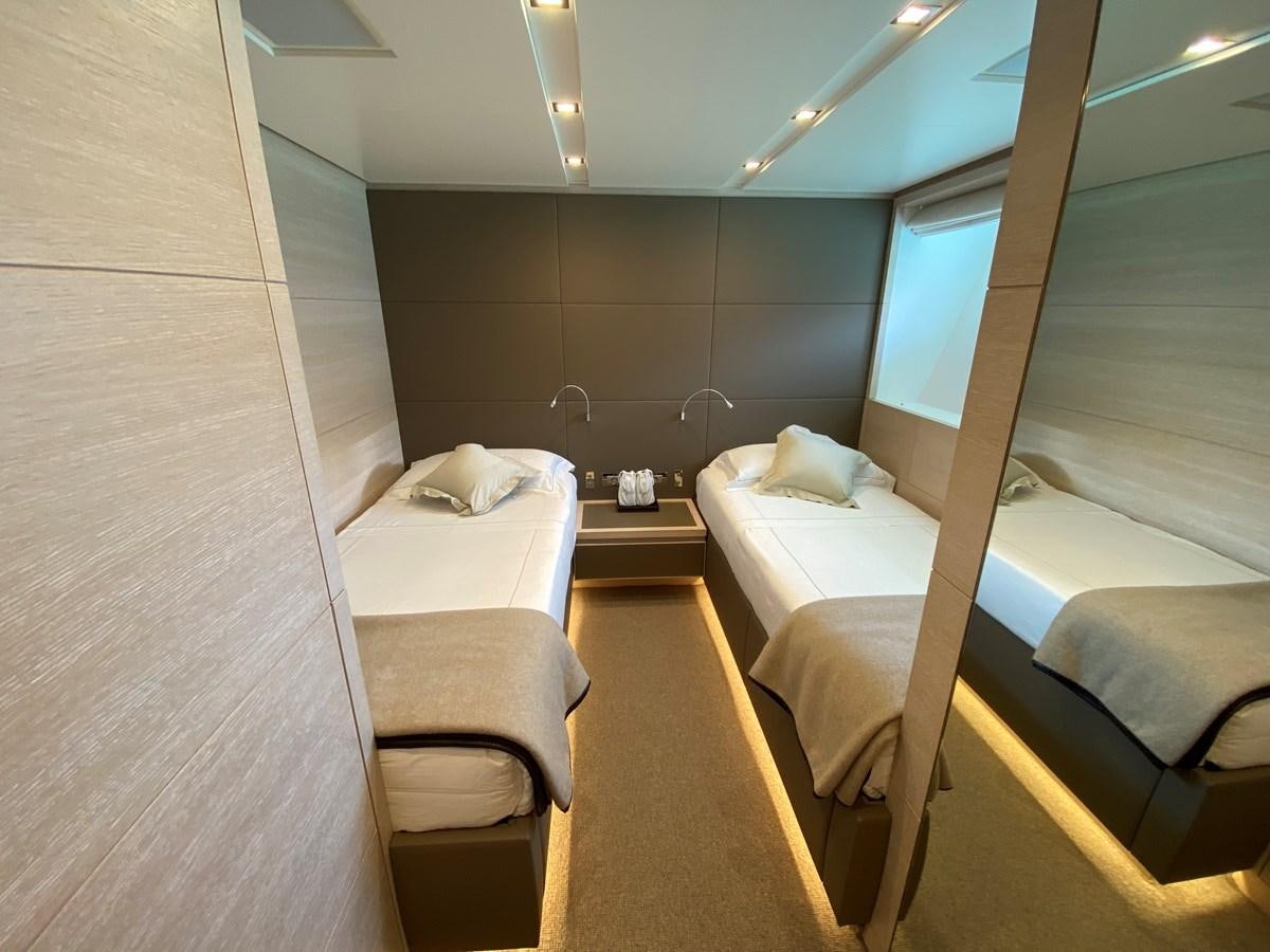 a room with a bed and a window aboard NAYA 7 Yacht for Sale
