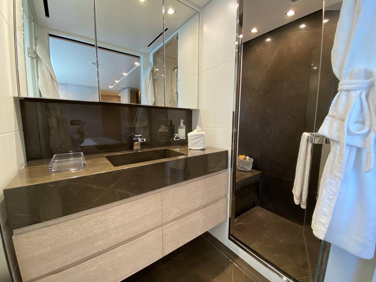 a bathroom with a large mirror aboard NAYA 7 Yacht for Sale