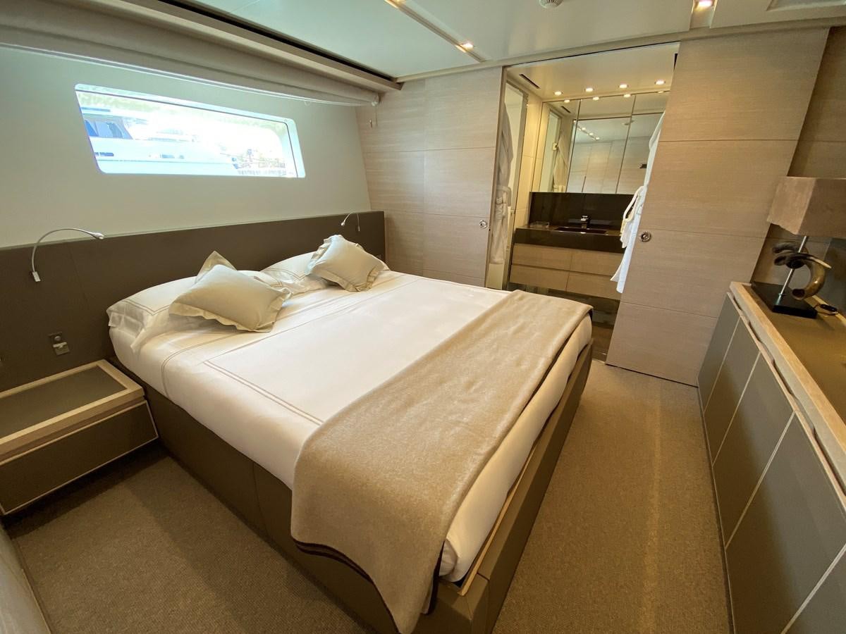 a room with a bed and a desk aboard NAYA 7 Yacht for Sale