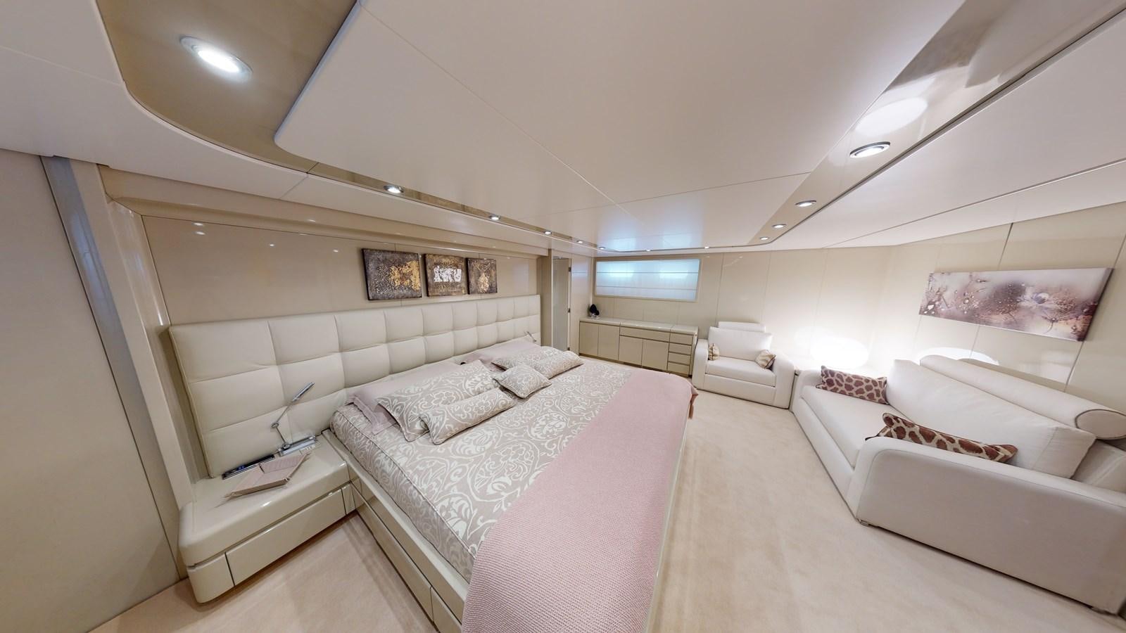 a room with a bed and a couch aboard IXIA Yacht for Sale
