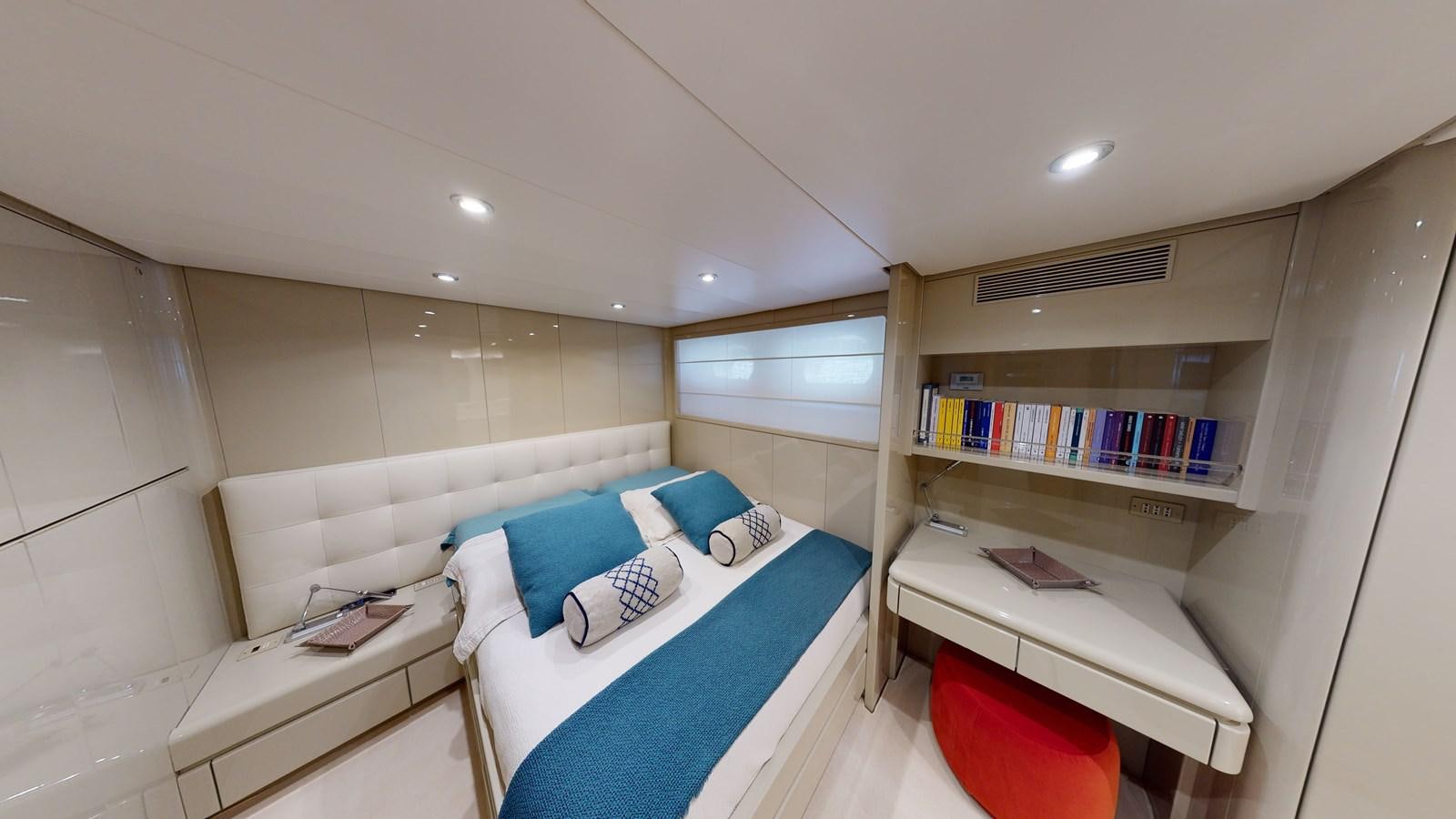 a room with a bed and a desk aboard IXIA Yacht for Sale