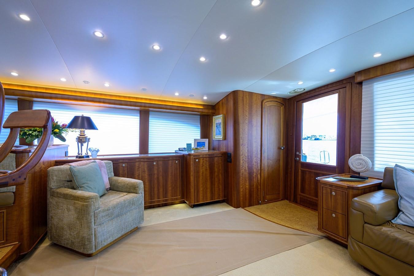 a living room with a wood cabinet aboard GEORGIA GIRL Yacht for Sale
