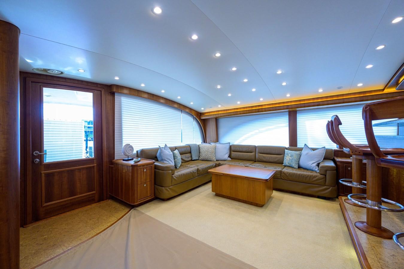 a living room with a couch and a table aboard GEORGIA GIRL Yacht for Sale