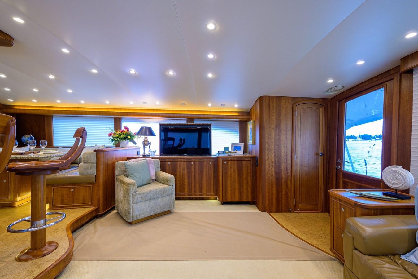 a living room with a large window aboard GEORGIA GIRL Yacht for Sale