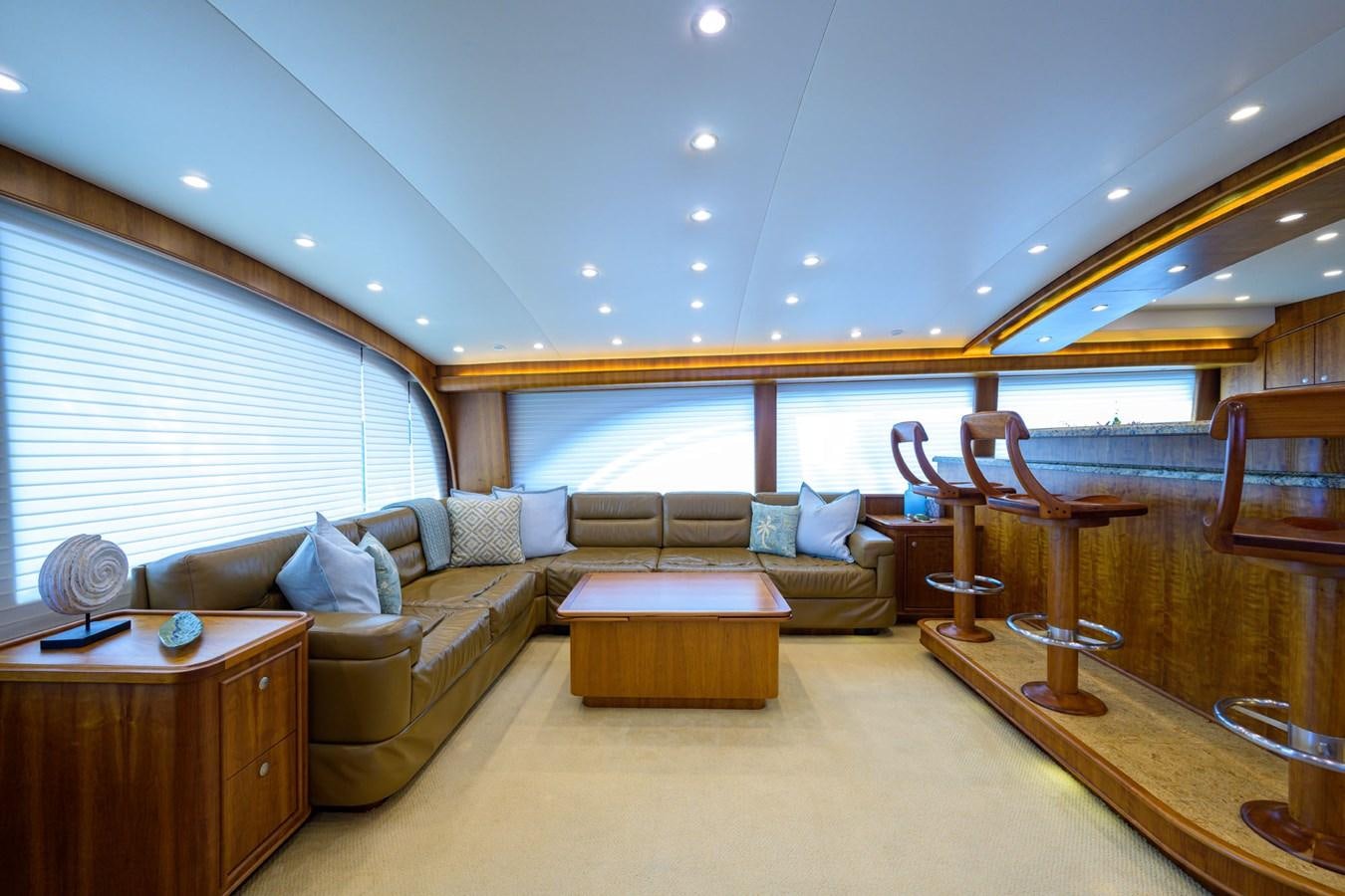 a living room with a couch and a table aboard GEORGIA GIRL Yacht for Sale