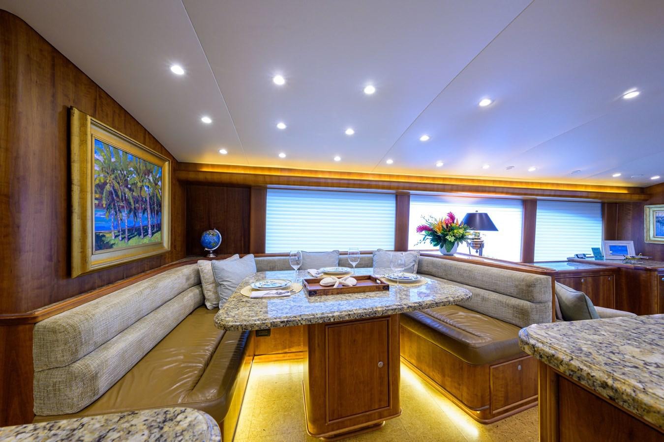 a living room with a couch and a table aboard GEORGIA GIRL Yacht for Sale