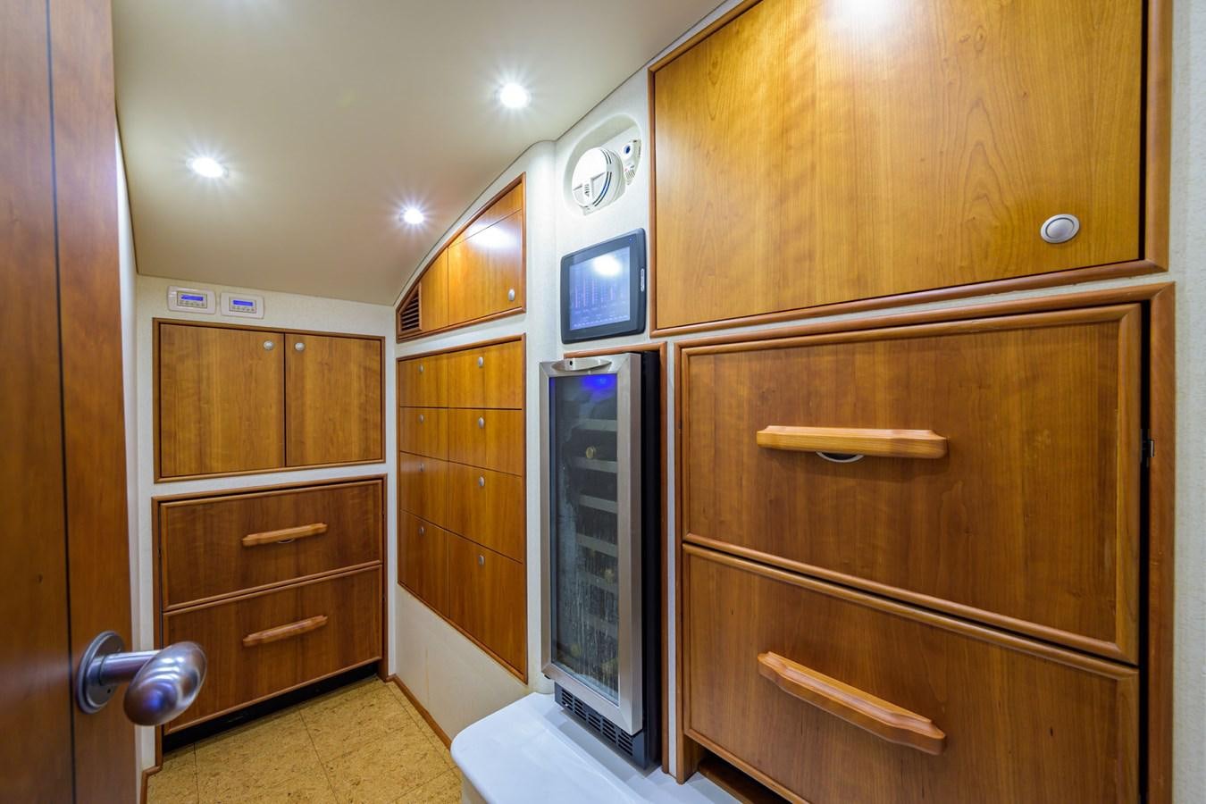 a room with wooden cabinets aboard GEORGIA GIRL Yacht for Sale
