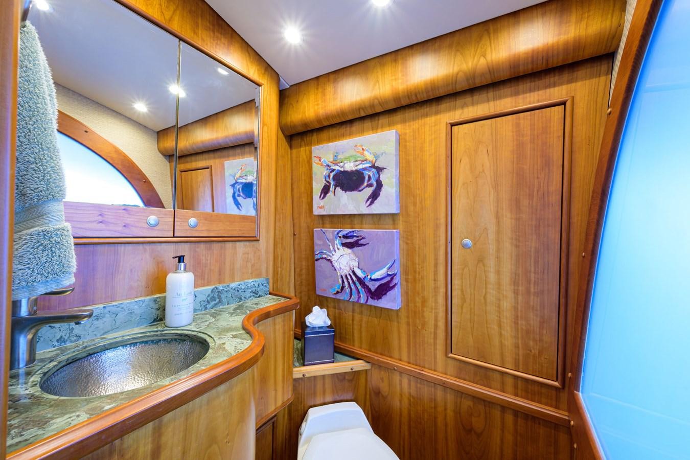 a bathroom with a sink and a mirror aboard GEORGIA GIRL Yacht for Sale
