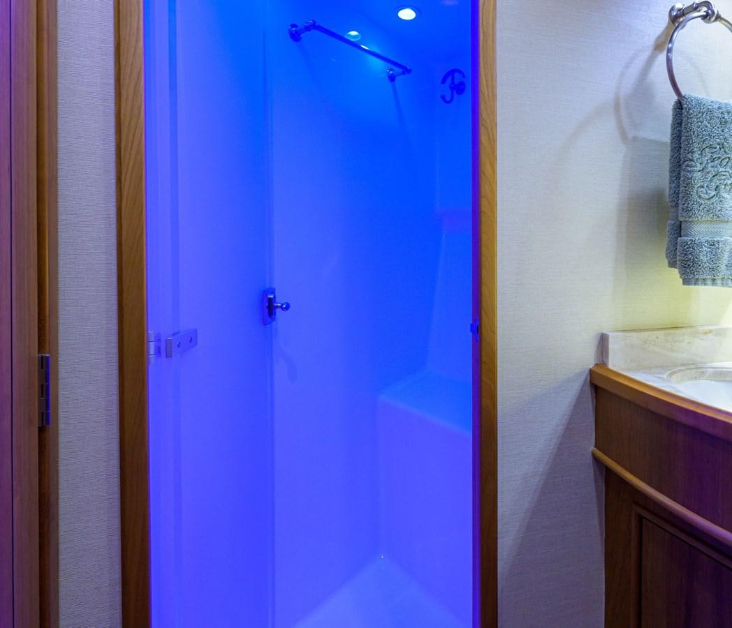 a bathroom with a shower and sink aboard GEORGIA GIRL Yacht for Sale