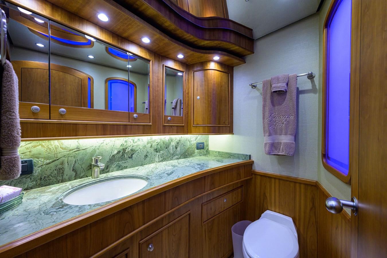 a bathroom with a sink and a mirror aboard GEORGIA GIRL Yacht for Sale