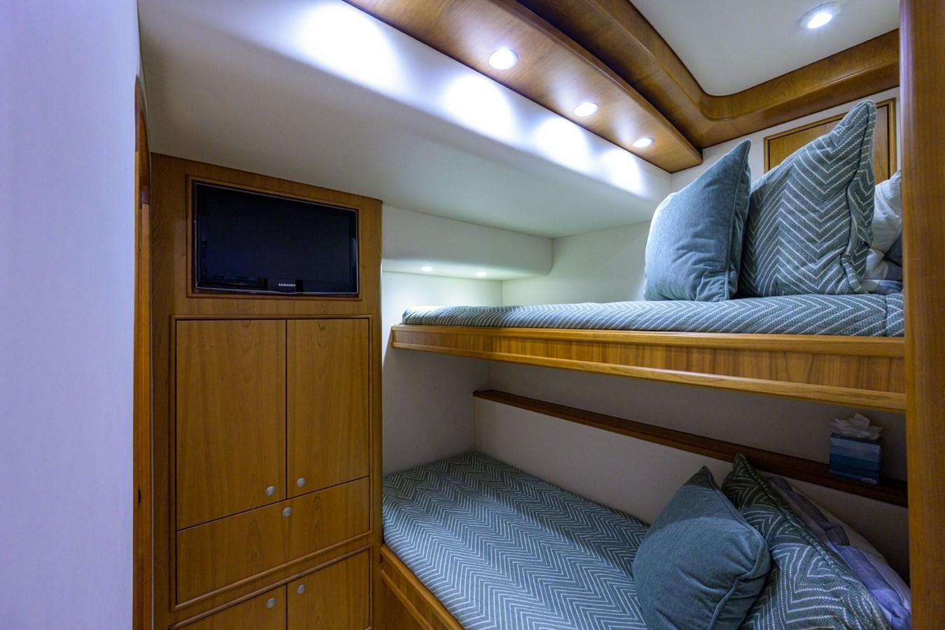 a bed with a television on top of it aboard GEORGIA GIRL Yacht for Sale