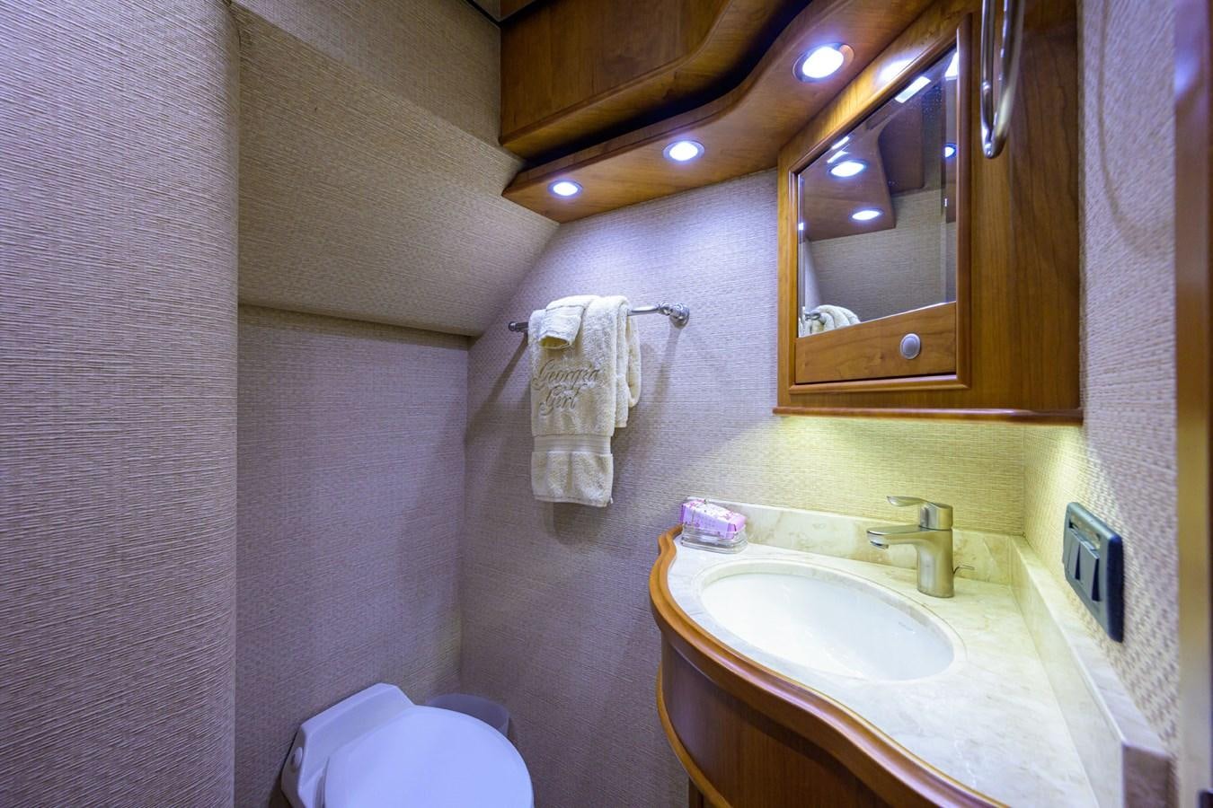a bathroom with a sink and a mirror aboard GEORGIA GIRL Yacht for Sale