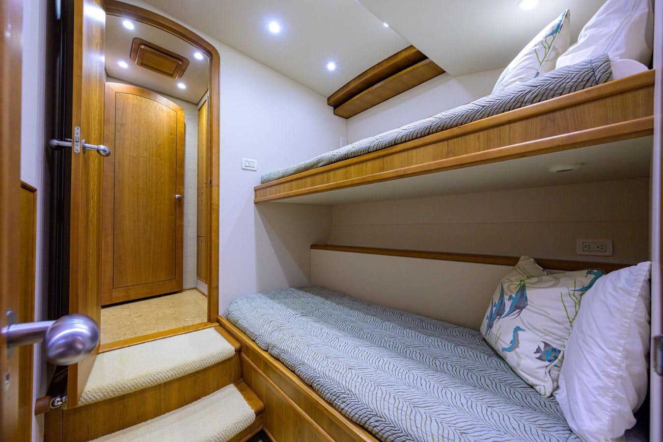 a bed with white sheets aboard GEORGIA GIRL Yacht for Sale