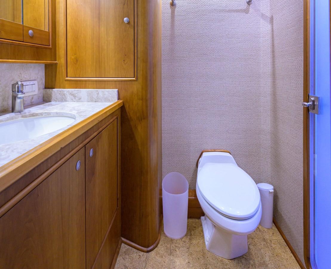 a bathroom with a toilet and sink aboard GEORGIA GIRL Yacht for Sale