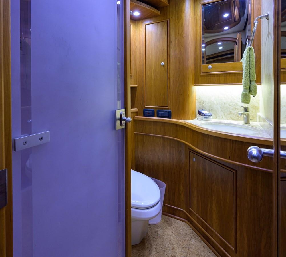 a bathroom with a toilet and sink aboard GEORGIA GIRL Yacht for Sale