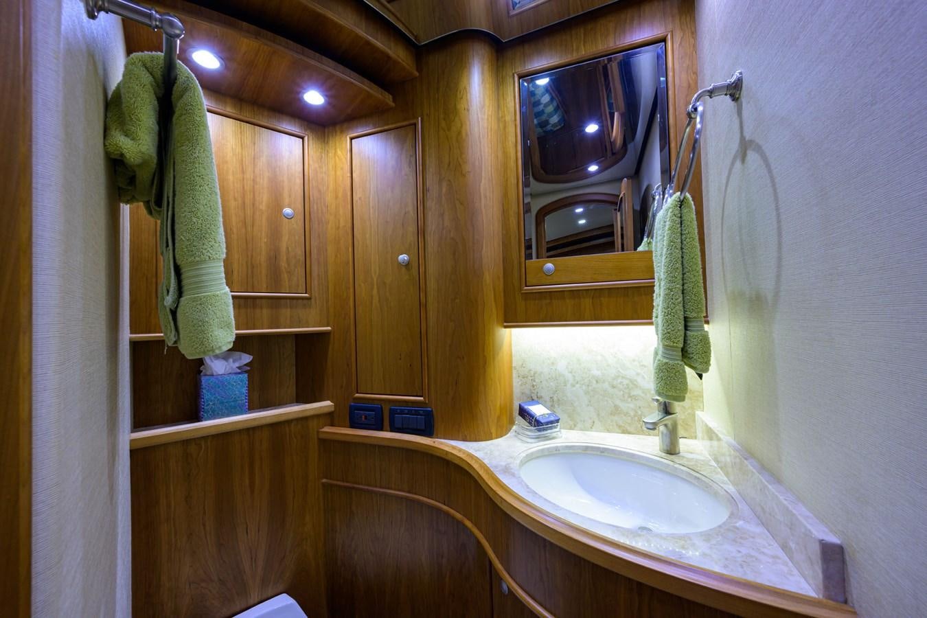 a bathroom with a sink and a mirror aboard GEORGIA GIRL Yacht for Sale