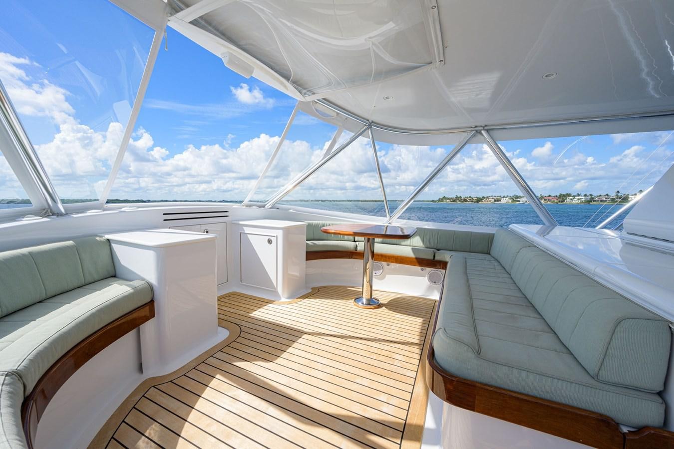 a room with a table and chairs aboard GEORGIA GIRL Yacht for Sale