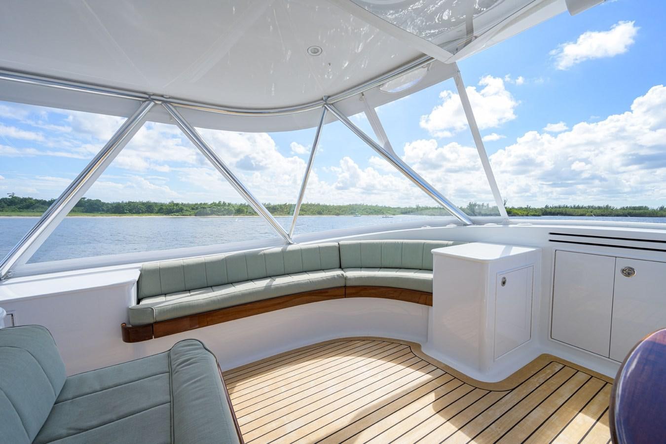 a room with a large window and a wood floor aboard GEORGIA GIRL Yacht for Sale