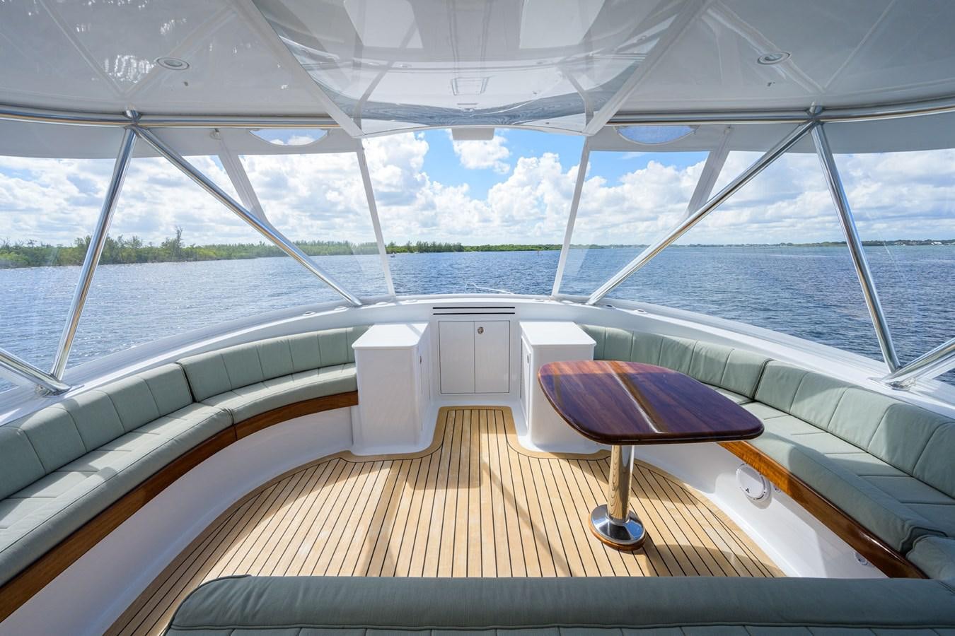 a deck with a view of the water and the land below aboard GEORGIA GIRL Yacht for Sale