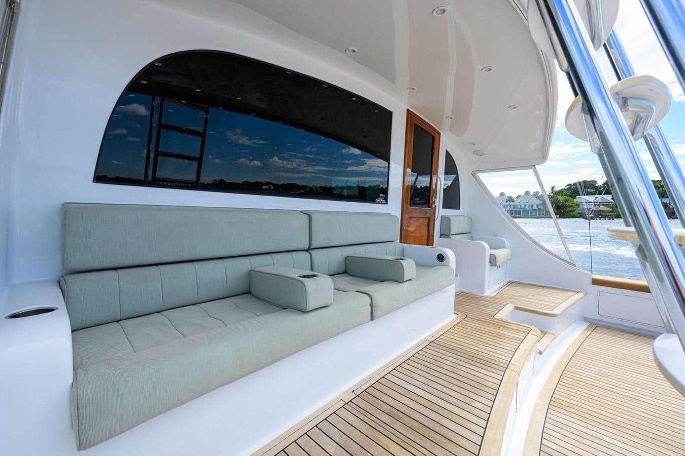 a room with a couch and a television on the wall aboard GEORGIA GIRL Yacht for Sale