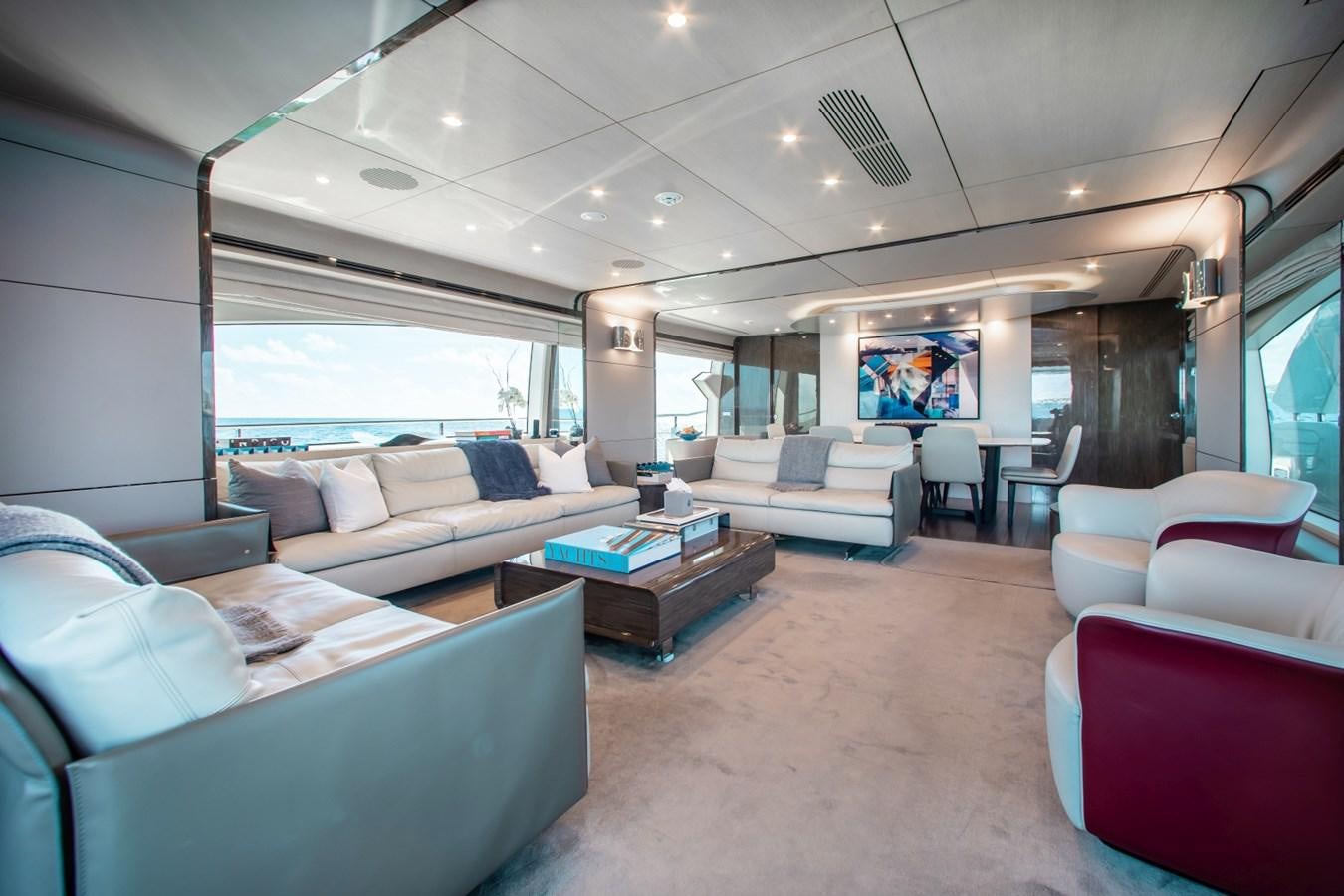 a living room with a large window aboard INDIGO Yacht for Sale
