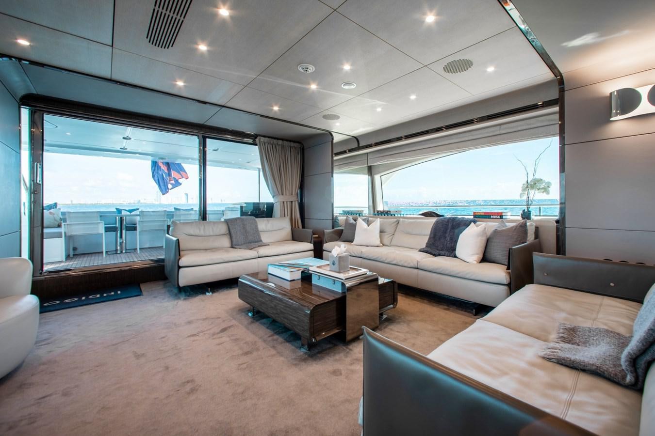 a living room with a large window aboard INDIGO Yacht for Sale