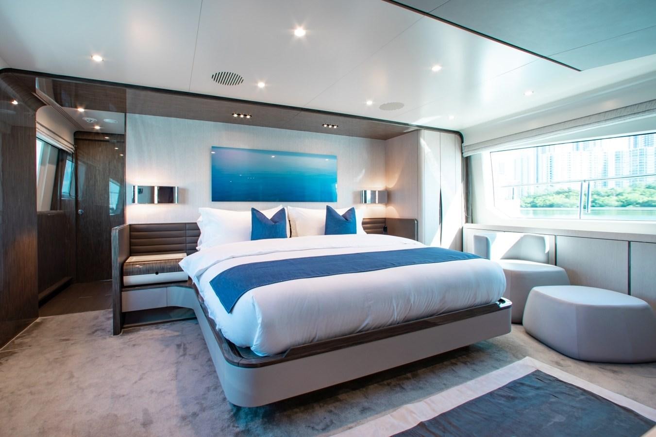 a large bed in a room aboard INDIGO Yacht for Sale