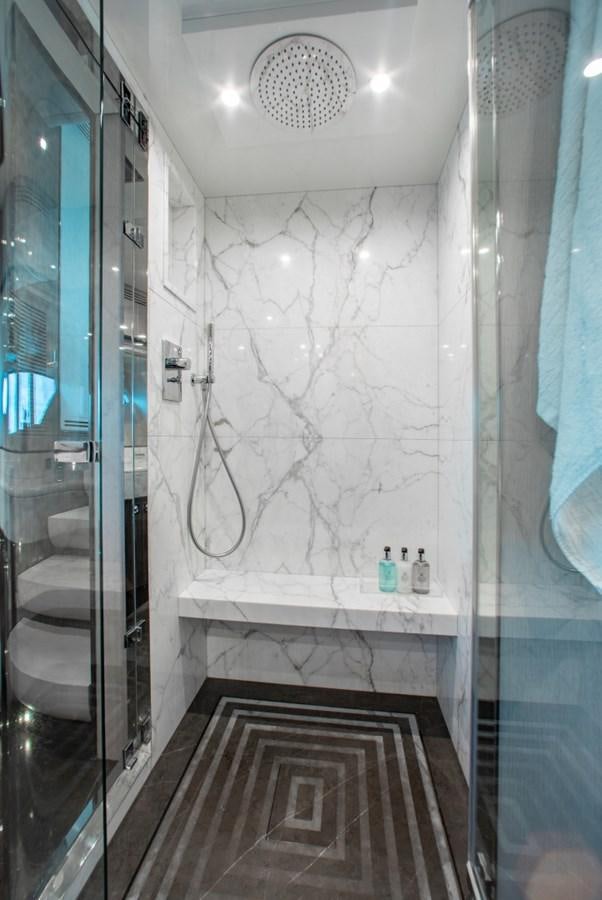 a bathroom with a shower aboard INDIGO Yacht for Sale
